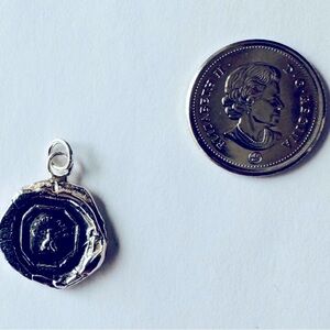 Pyrrha talisman pendant.